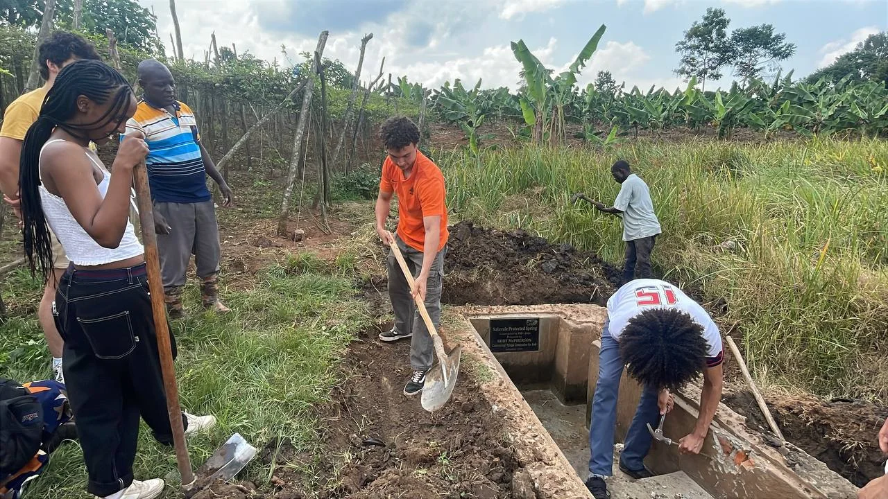 Participants working together at a spring protection site